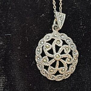 18 inch sterling silver chain with marcasite pendant.